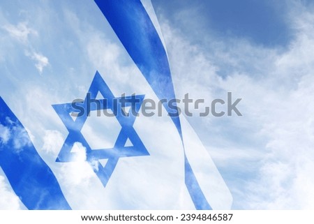 National flag of Israel and blue sky with clouds, double exposure Royalty-Free Stock Photo #2394846587
