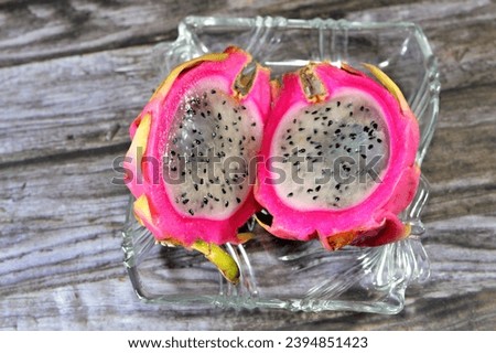 Dragon fruit, pitaya, pitahaya, fruit of the genus Selenicereus (formerly Hylocereus), both in the family Cactaceae, leather-like skin and prominent scaly spikes on the fruit exterior, strawberry pear