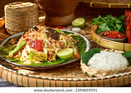 Sticky rice, papaya salad, Som Tam , som tum, thai food, isan food,Thai isan kitchen Royalty-Free Stock Photo #2394859591