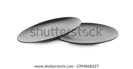 Two clean ceramic plates on white background Royalty-Free Stock Photo #2394868327