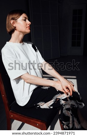 Portrait of a beautiful fashionable woman with short hair