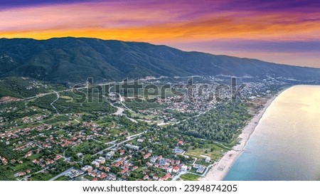 Asprovalta, Greece. Sunny summer day. Panoramic view Asprovalta, drone view. Ariel from above, top. Adriatic sea beach background of mountains and beautiful mountain landscape at sunrise or sunset. 