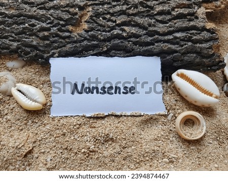 Nonsense writing on beach sand background.