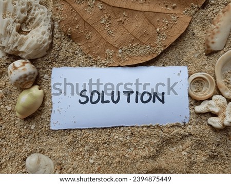 Solution writing on beach sand background.