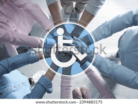 Inclusion concept. International symbol of access. People holding hands together, top view