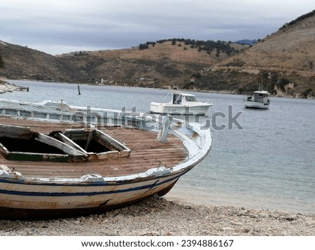 Picture from porto di palermo in albania with boat in foreground
