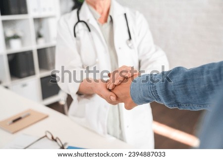 Care and patients. Doctor touching patient`s hand. Recuperation and healing process. Psychotherapy and diagnosis. Cancer treatment. Support and hope Royalty-Free Stock Photo #2394887033
