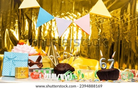 Date of Birth  67. Festive party word from candles. Scenery with gift boxes, greeting card anniversary gold background. Birthday. copy space