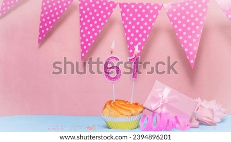 Date of Birth  61. Greeting card in pink shades. Anniversary candle numbers. Happy birthday girl, polka dot garland decoration. Copy space.