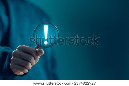 businessman shows an icon exclamation mark. points attention. concept of signal alert, caution, or idea. information important in business and security
 Royalty-Free Stock Photo #2394922929
