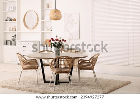 Stylish dining room interior with comfortable furniture. Space for text