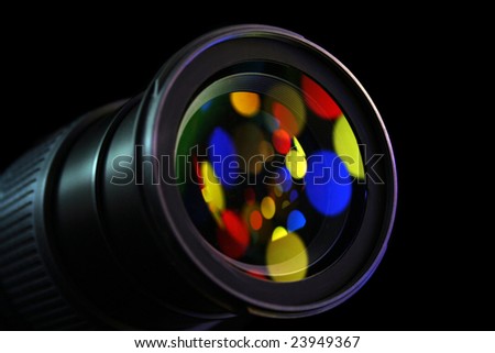 lens of the digital camera in colour light