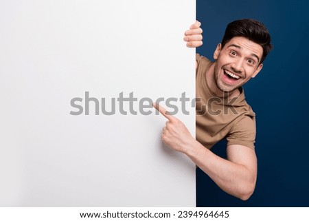 Photo of glad joyful man wear trendy clothes demonstrate benefit news cool feedback empty space isolated on dark blue color background Royalty-Free Stock Photo #2394964645