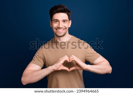 Photo of friendly nice man wearing stylish beige clothes two arms showing you heart sympathy flirt isolated on dark blue color background Royalty-Free Stock Photo #2394964665