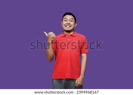 Side view of adult Asian man smiling confident and give thumb up