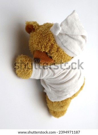 Good morning sleepy head stuffed animal teddy bear with jammies good night and having good dreams white background