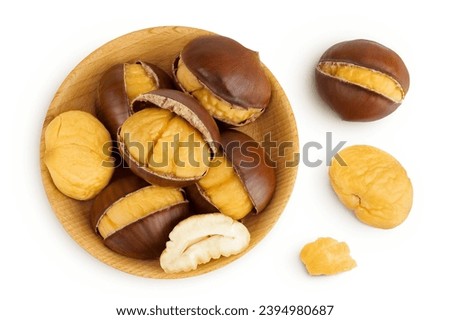 roasted peeled chestnut in wooden bowl isolated on white background. Top view. Flat lay Royalty-Free Stock Photo #2394980687