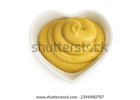 Mustard sauce in ceramic bowl isolated on white background. Top view. Flat lay