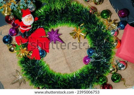 Christmas composition . Gift, Fir tree branches ,red decorations. Christmas, winter, new year concept , view with Christmas Santa clause ,bells and colorful star, copper bells and gift boxes