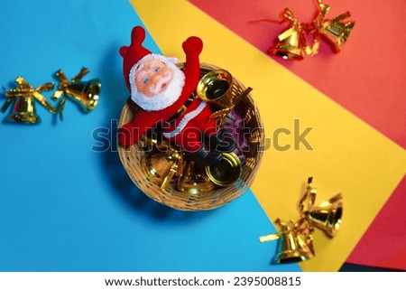 Christmas composition . Gift, Fir tree branches ,red decorations. Christmas, winter, new year concept , view with Christmas Santa clause ,bells and colorful star, copper bells and gift boxes