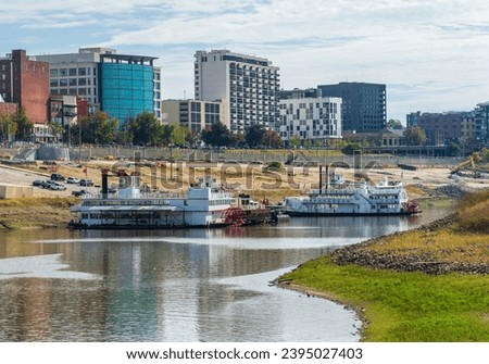 Memphis Tennessee cityscape with low water levels in the Wolf River Harbor with casino river boats almost marooned
