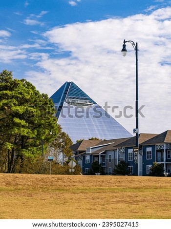 Memphis Pyramid rises above the modern apartments and homes on Harbor Town in Memphis Tennessee