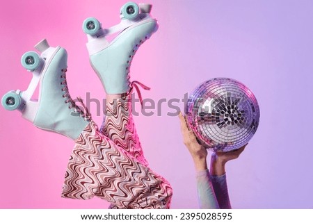 Beautiful young woman in roller skates with disco ball on color background, closeup