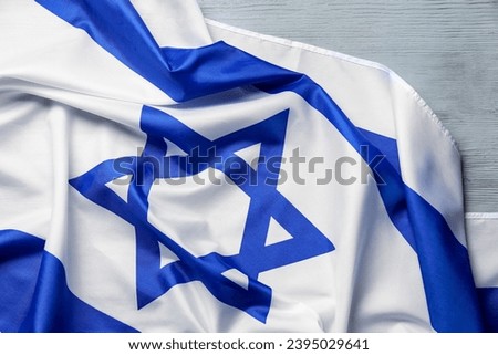Flag of Israel on grey wooden background