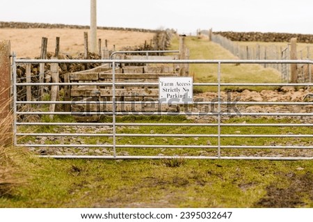 Sign warning that farm access is needed and not to park.