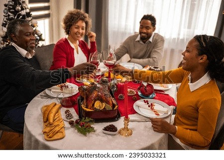 Family toasts with wine on Christmas Eve.