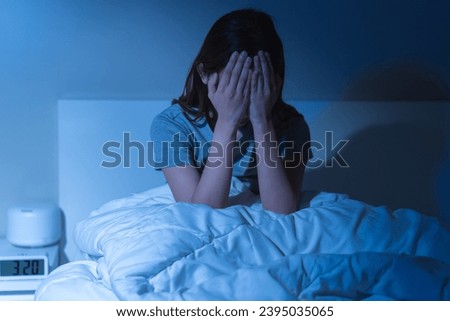 Annoyed, stressed, anxiety asian young woman suffering from insomnia, frustrated awake on bed at night, headache or migraine, health care problem, disturbed trouble of loud noise, unable sleepless. Royalty-Free Stock Photo #2395035065