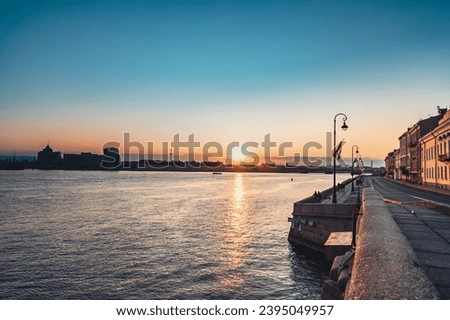 Sunrise over Neva river on Palace embankment. Early morning in Saint Petersburg. Russia