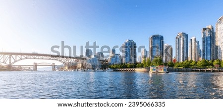 Residential Home Buildings in Modern City. Sunny Sunset. False Creek, Downtown Vancouver, BC, Canada.