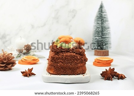 Homemade winter dessert, stollen or strudel with sweet cream filling, nuts, cinnamon and poppy seeds. Concept for holiday bakery, seasonal treats and cafe advertising, selective focus