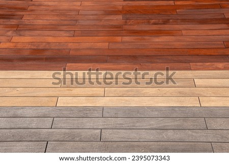 Wood planks texture - weathered, sanded, and freshly stained ipe deck, before and after maintenance concept Royalty-Free Stock Photo #2395073343