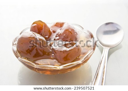 Fig jam in glass bowl with a spoon