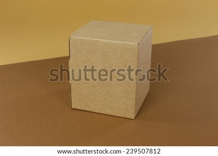Brown cardboard box on a brown background