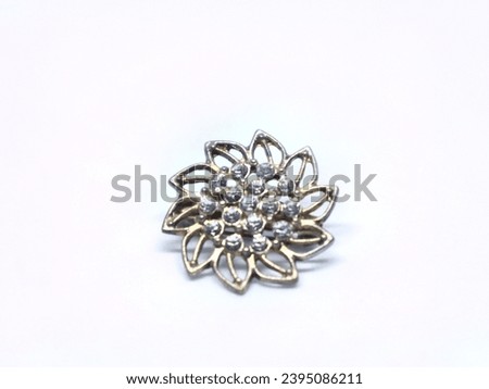 Floral patterned Muslim hijab brooch. Isolated on white background.