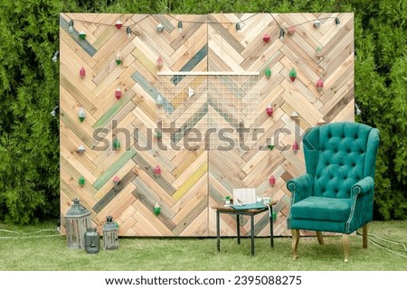 Beautiful display wall for a wedding featuring a chevron pattern made with reclaimed wood as a wonderful photo backdrop. Rustic chevron wedding backdrop made from reclaimed wood.