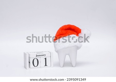 Dentist Merry Christmas And Happy New Year 2024. Concept On Blue Background With Copy Space. Dental figurines and dental instruments for Christmas and New Year.  Happy New Year to dentists
