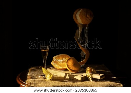 orange liqueur and oranges on the table. Still life