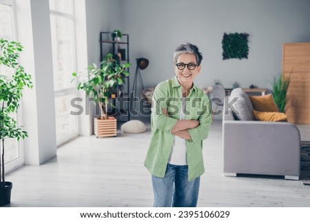 Photo of selfassured business woman crossed hands confident spending working days inside spacious office open space location indoors Royalty-Free Stock Photo #2395106029