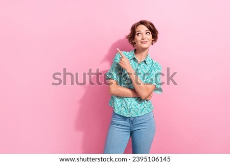 Portrait of attractive lady direct look empty space interesting ad poster wear casual shirt denim pants isolated pink color background