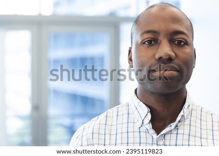 Portrait of african american man in hospital waiting room with copy space. Medicine, healthcare and medical services, unaltered.