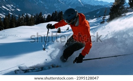 Freerider skiing off piste in high mountains, freeze motion