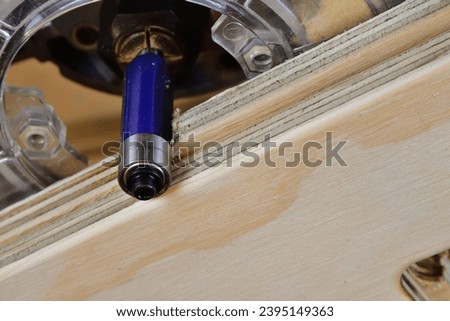 Wood router flush trim bit with double bearing. Template routing technic straight cut. Cam follower wood router bit for template. Woodworking cutting tool template trim wood router cutter. Royalty-Free Stock Photo #2395149363
