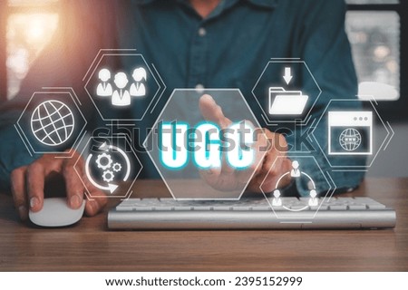 UGC, User generated content concept, Businessman using comuter on office desk with User generated content icon on virtual screen. Royalty-Free Stock Photo #2395152999
