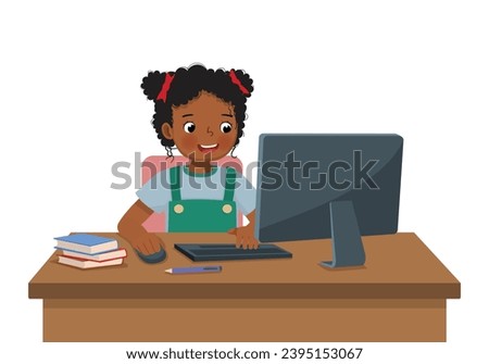 Cute little African girl student study using Computer PC at the desk