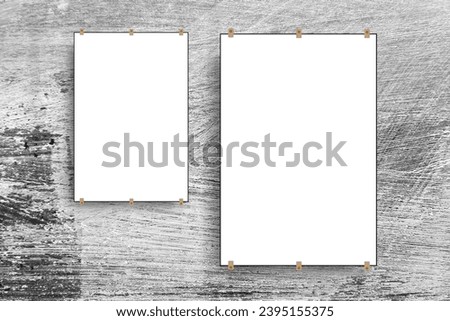 Two pure white paper posters without texture, hanging on the wall with abstract background, place for movie posters or advertisements