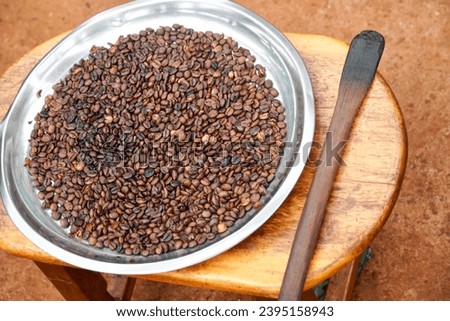 Small Batch of Roasted Arabica Berries                      Royalty-Free Stock Photo #2395158943